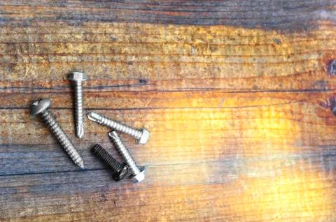 Screws on table Stock Photos