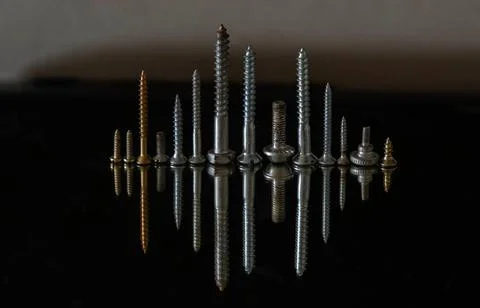 Screws of various types in a row duplicated by reflex Stock-Fotos