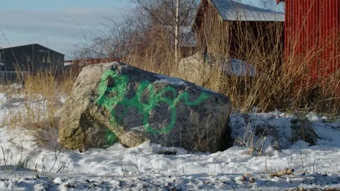 Scribble / Doodle On Stone In Front Of Old Rundown Shelters Stock Footage 168905860