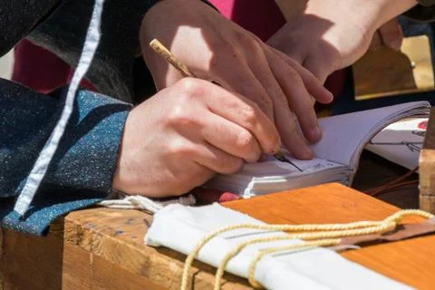 Scribe practicing traditional illumination Stock Photos