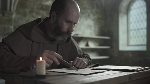 Scribe studying a religious page, moving a penknife tip along lines Stock Footage 340079719