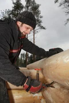Scribing the log, Worker makes logs markup. Stock Photos