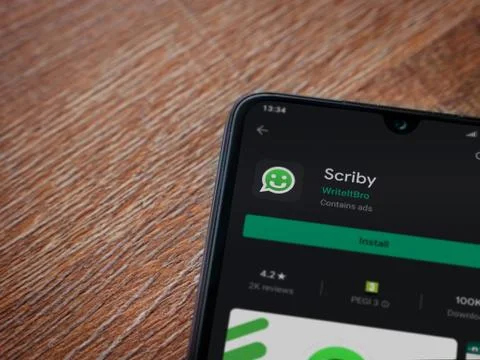 Scriby app play store page on the display of a black mobile smartphone on woo Stock Photos