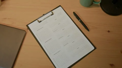 Script and Pen on Wooden Table Stock Footage 310389379