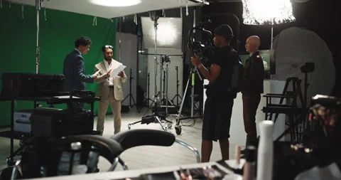 Script, green screen and broadcast with people in studio for news anchor Stock Footage 312249615