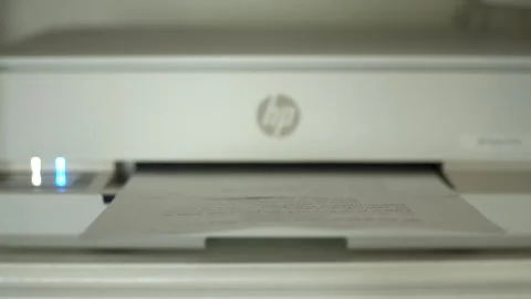 Script pages printing from a desktop printer in a static shot. Clean office Video stock 334811167