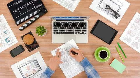 The script writer checks and drowing the storyboard, view top. Stock Photos