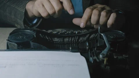 Script writer prints the text on a typewriter Stock Footage 134807513