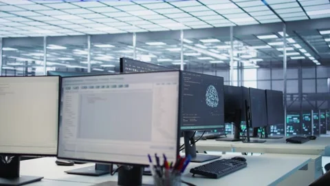 Scripts running on desktop PC monitors upgrading servers in data center Stock Footage 319267945
