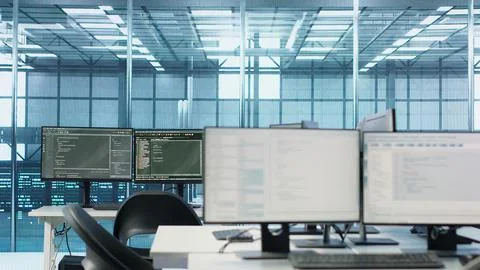 Scripts running on desktop PC monitors upgrading servers in data center Stock Photos