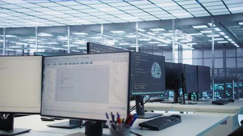 Scripts running on desktop PC monitors upgrading servers in data center Stock Photos
