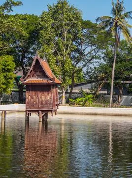 The scripture hall is made of wood located in the pond,thai style Foto stock