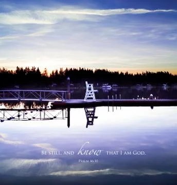 Scripture from Psalm 46:10 on a tranquil lake with a dock at sunset Stock Photos