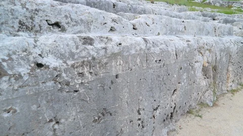 The scriptures on the wall of the greek theatre in Neapolis in Italy 스톡 동영상 87538290