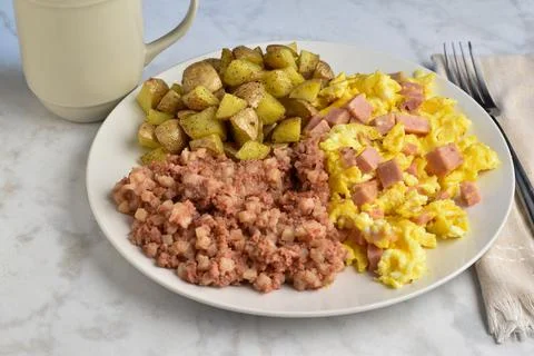 Scrmb;e eggs and spam  with corn beef hash Stock Photos