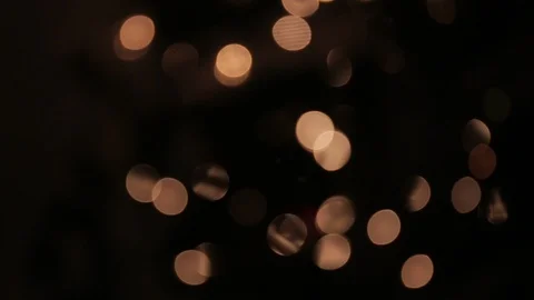 Scroll of blurred lights on a black background Stock Footage 99876519