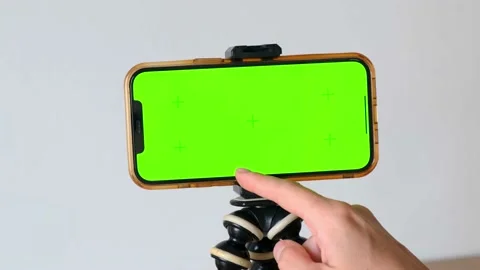 Scroll with finger at bottom of green screen of phone. Close-up of finger 스톡 동영상 224744767