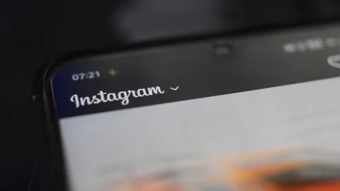 Scroll instagram social network app on the iphone screen. phone instagram app. Stock-Footage 235980627