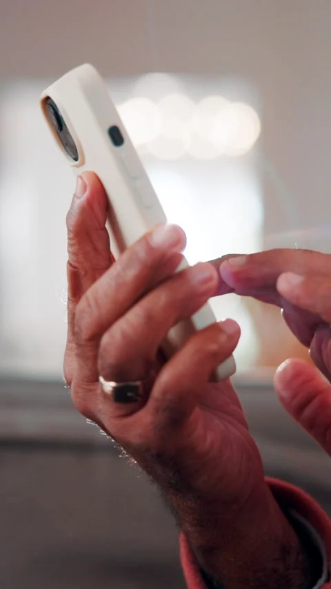 Scroll, phone and hands of old man on sofa in home for bingo app, social media Stock Footage 338375274