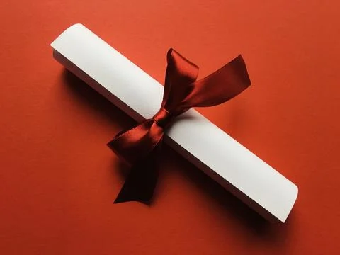 Scroll with a red ribbon Stock Photos
