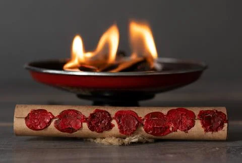 Scroll with seven seals and burning fire flames, prophecy and revelation concept Stock Photos