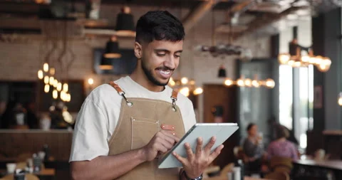 Scroll, waiter or happy man with tablet in restaurant, digital menu review or 動画素材 321860116