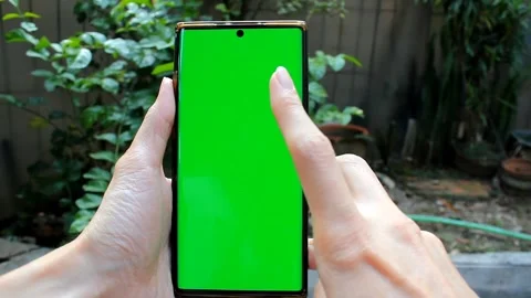 Scrolling and double tap the smartphone screen with greenscreen, with garde.. Stock Footage 291695716