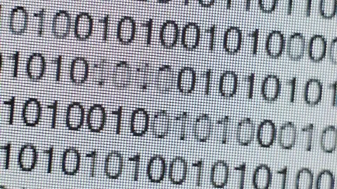 Scrolling binary code on a computer screen Stock Footage 72065304