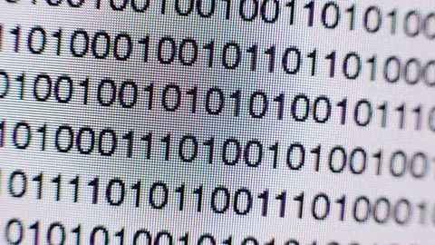 Scrolling binary code on a computer screen Stock Footage 72104295