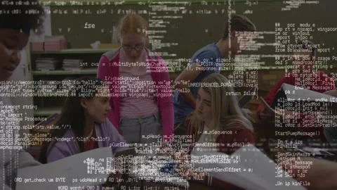 Scrolling code overlay appearing, partly obscuring students collaborating on Stock Footage 331197465