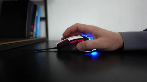Scrolling with a computer mouse. Close-up of a hand using a computer mouse. Stock Footage 303216253