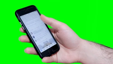 Scrolling the Facebook home on iPhone Stock Footage 107685839