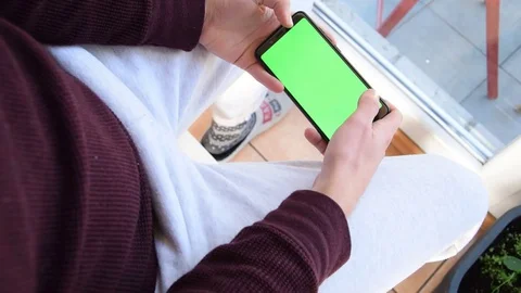 Scrolling on the green screen Stock Footage 129767958