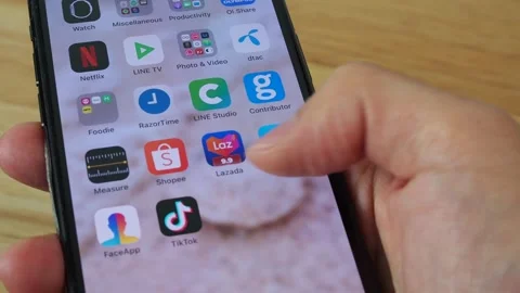 Scrolling home screen pages, browsing for app icons Video stock 141176881