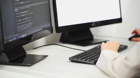 Scrolling the HTML web page code. Young female programmer Stock Footage 168352831