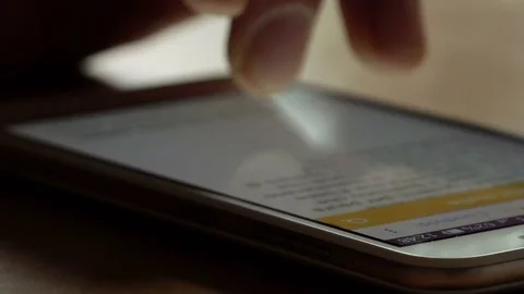 Scrolling internet page on smartphone using finger on a touchscreen display Video stock 74410666