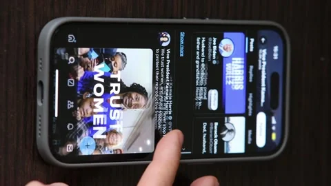 Scrolling Kamala Harris, X App, Profile Page on an iPhone. Stock Footage 289398301