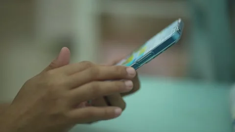 Scrolling the Mobile Phone Stock Footage 260628955