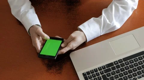 Scrolling on the mobile screen at work, green screen Stock Footage 60698589