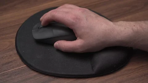 Scrolling mouse wheel on ergonomic mousepad, close up view Stock Footage 333897421