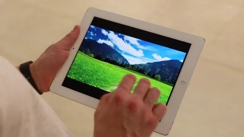 Scrolling photos in the tablet Video stock 73197750