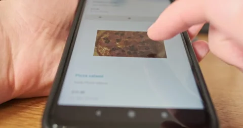 Scrolling restaurant menu on smartphone screen, close-up. Concept of Vídeo Stock 255824017