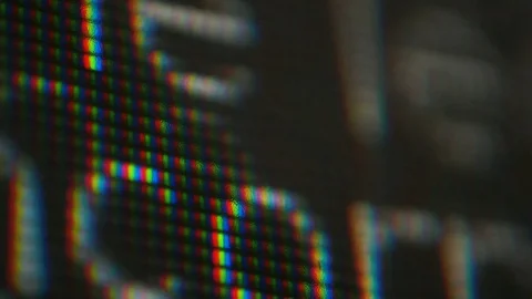 Scrolling screen text words close up pixel macro fine print legal code Stock Footage 94975277