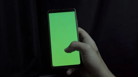 Scrolling on Smartphone with Green Screen Background – 4K Stock Footage 311470435