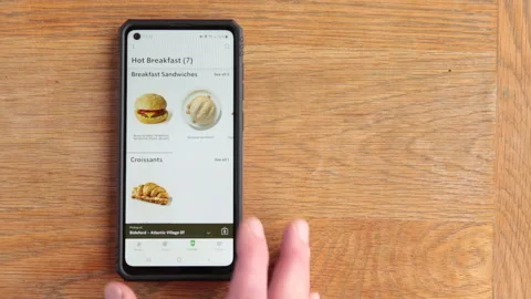 Scrolling Starbucks menu on android phone in the time of Covid in the UK Stock Footage 147269271