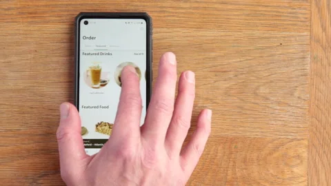 Scrolling Starbucks menu on android phone in the time of Covid in the UK Stock Footage 147269305