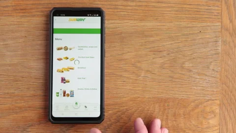 Scrolling Subway menu on android phone in the time of Covid in the UK Stock Footage 147265645