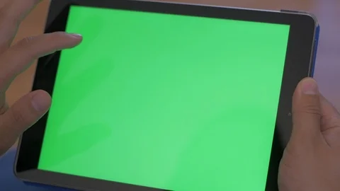 Scrolling on Tablet with Green Screen Logo Placeholder Stock Footage 116843715