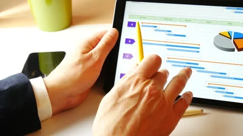Scrolling tablet showing a gantt for project management purposes Stock Footage 151622991