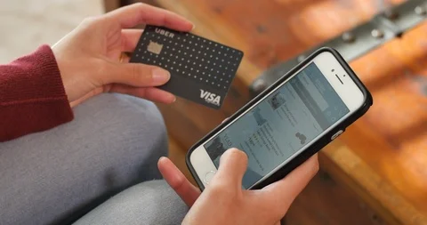 Scrolling through Amazon.com App on Phone Shopping Online with Credit Card Stock Footage 126402487